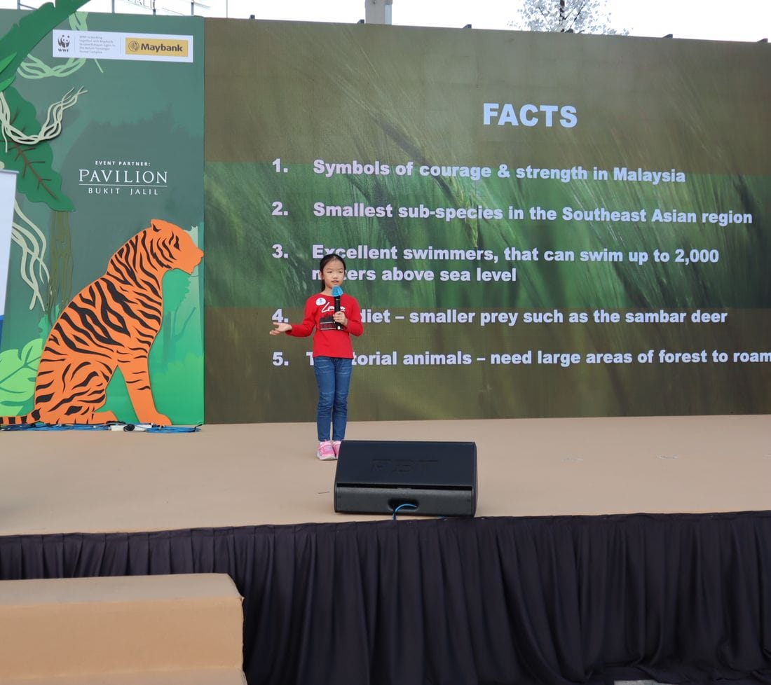 A young speaker on stage